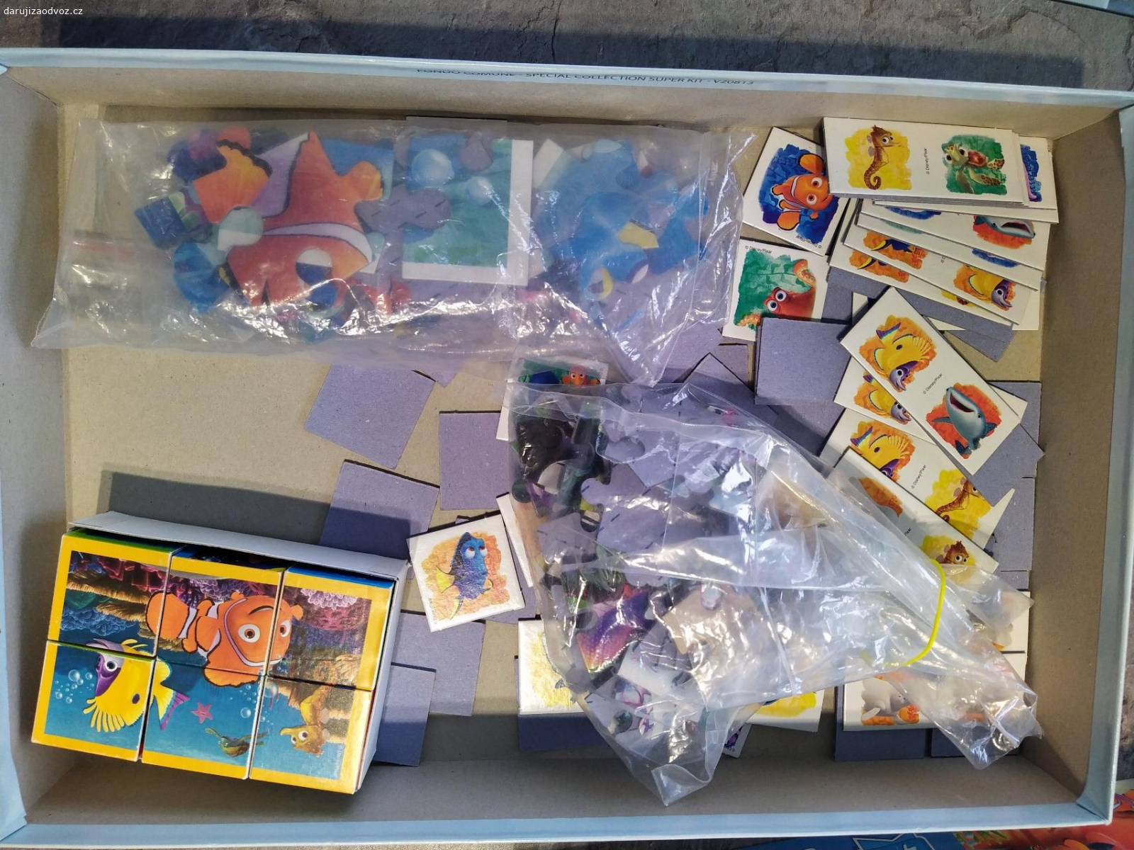 Hledá se Dory. Puzzle, domino a pexeso, kartičky v krásném stavu, jen řízek krabice mírně poškozený. Předání Prostějov, Přerov či po trase.