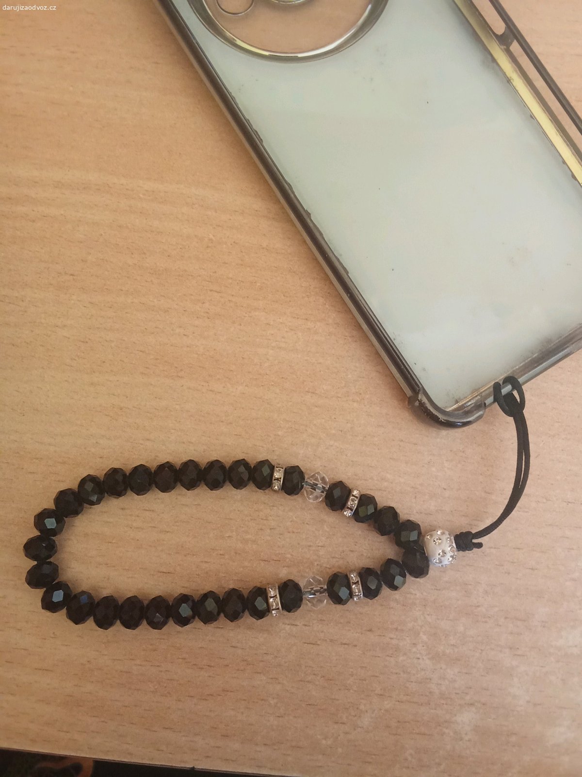 přívěsek na kryt telefonu. černý, 15cm dlouhý